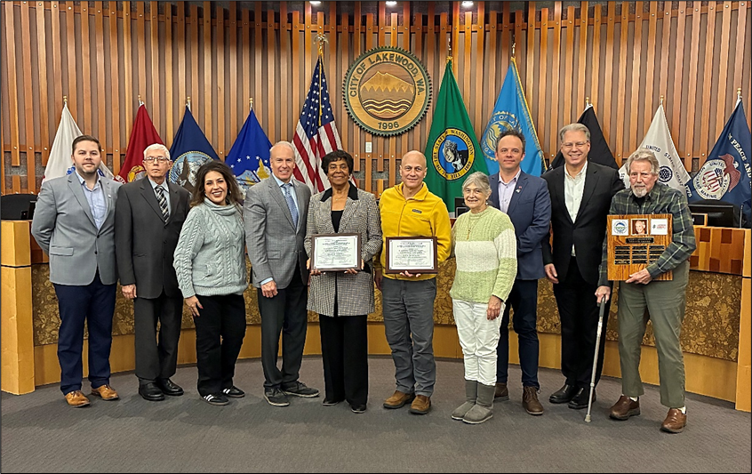 Mary Moss and Ben Sclair received their awards at the City Council meeting of December 1